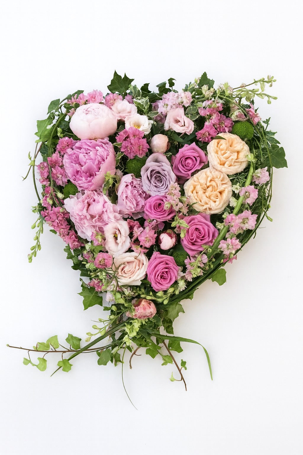 Pastel toned full heart funeral wreath